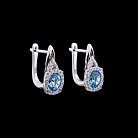 Золоті сережки з блакитним топазом і діамантами с342А1 от ювелирного магазина Оникс