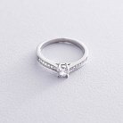 Серебряное помолвочное кольцо с фианитами 112071 от ювелирного магазина Оникс