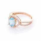 Золотое кольцо с голубым топазом и фианитами к04656 от ювелирного магазина Оникс - 1
