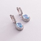 Срібні сережки з блакитними топазами і фіанітами 121334 от ювелирного магазина Оникс