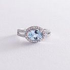 Серебряное помолвочное кольцо с голубым топазом и фианитами 111457 от ювелирного магазина Оникс